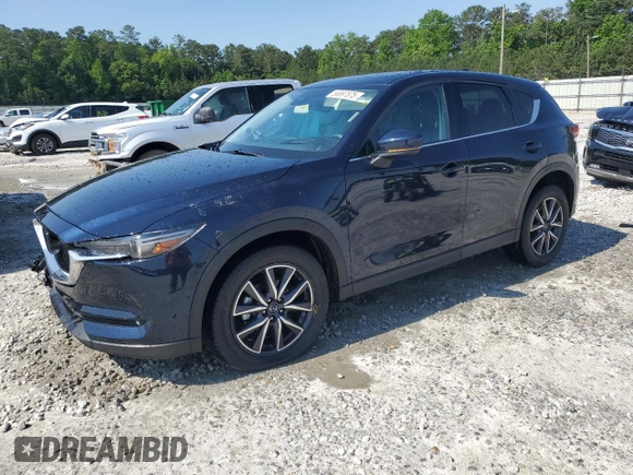 2018 Mazda CX-5 Grand Touring z VIN JM3KFADM5J1420690, wystawiony jako Copart lot #56897875 z przebiegiem 46 483 mil mil oraz Szkoda całkowita • Salvage title. Historia ofert i sprzedaży dostępna na DreamBid. Obrazek 1.