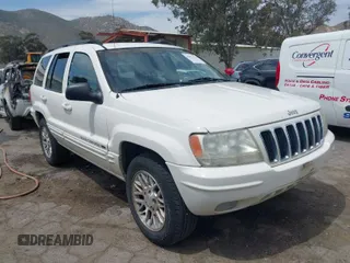 2002 Jeep Grand Cherokee Limited with VIN 1J4GX58S52C305020, listed as a IAAI auction lot 42025324 with 214,214 mi miles and . Bid and sale history available at DreamBid. Image 1.