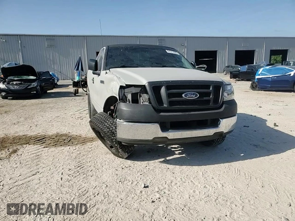 2005 Ford F-150 XL with VIN 1FTRF12235NC10435, listed as a Copart auction lot 57311935 with 249,847 mi miles and Salvage title. Bid and sale history available at DreamBid. Image 14.