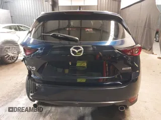 2020 Mazda CX-5 Touring with VIN JM3KFBCM5L0751284, listed as a IAAI auction lot 42157556 with 50,011 mi miles and . Bid and sale history available at DreamBid. Image 16.