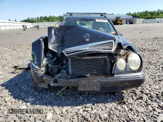 1999 Mercedes-Benz E-Class with VIN WDBJH82F8XX020574, listed as a Copart auction lot 63730124 with 201,401 mi miles and Salvage Title. Bid and sale history available at carsss.com. Image 5.