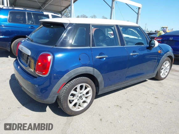 2015 MINI Hardtop 4 Door with VIN WMWXS5C50FT832438, listed as a IAAI auction lot 42632469 with 96,432 mi miles and . Bid and sale history available at DreamBid. Image 4.