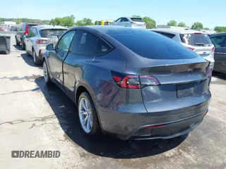2023 Tesla Model Y Long Range with VIN 7SAYGDEE5PF882582, listed as a IAAI auction lot 42059015 with 10,567 mi miles and . Bid and sale history available at carsss.com. Image 3.