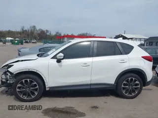 2016 Mazda CX-5 Grand Touring with VIN JM3KE4DY6G0618121, listed as a IAAI auction lot 41958805 with 101,232 mi miles. Bid and sale history available at carsss.com. Image 15.