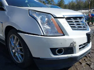 2014 Cadillac SRX Performance Collection with VIN 3GYFNFE30ES586713, listed as a IAAI auction lot 41791356 with 74,927 mi miles and . Bid and sale history available at DreamBid. Image 6.