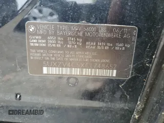 2012 BMW X5 35i z VIN 5UXZV4C5XCL748652, wystawiony jako Copart lot #55457455 z przebiegiem 149 030 mil mil oraz Szkoda całkowita • Salvage title. Historia ofert i sprzedaży dostępna na DreamBid. Obrazek 13.