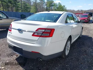 2015 Ford Taurus SE with VIN 1FAHP2D80FG176157, listed as a IAAI auction lot 41985771 with 102,252 mi miles and . Bid and sale history available at carsss.com. Image 4.