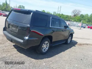 2020 Chevrolet Tahoe LT with VIN 1GNSKBKCXLR255963, listed as a IAAI auction lot 42127845 with 46,746 mi miles and . Bid and sale history available at DreamBid. Image 4.