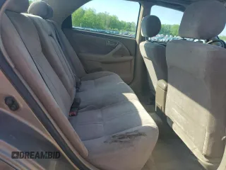 1999 Toyota Camry LE z VIN JT2BG22K0X0295893, wystawiony jako Copart lot #56183655 z przebiegiem 327 172 mil mil oraz Szkoda całkowita • Salvage title. Historia ofert i sprzedaży dostępna na DreamBid. Obrazek 10.