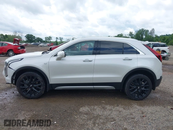 2022 Cadillac XT4 AWD Premium Luxury z VIN 1GYFZDR42NF128199, wystawiony jako IAAI lot #42522314 z przebiegiem 29 002 mil mil oraz . Historia ofert i sprzedaży dostępna na DreamBid. Obrazek 14.