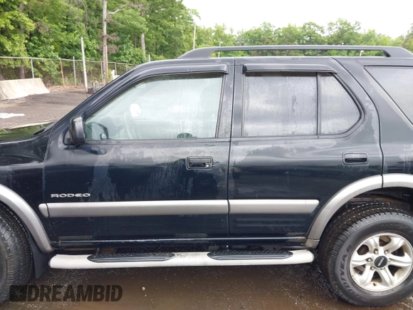 2003 Isuzu Rodeo with VIN 4S2DM58W234312253, listed as a IAAI auction lot 42319453 with 187,939 mi miles and . Bid and sale history available at DreamBid. Image 14.