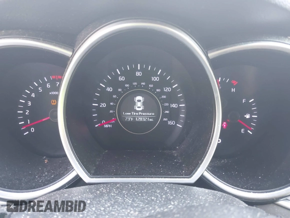 2015 Kia Optima LX with VIN KNAGM4A76F5663782, listed as a IAAI auction lot 42162942 with 128,321 mi miles. Bid and sale history available at carsss.com. Image 7.