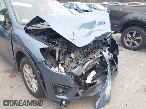 2015 Mazda CX-5 Touring with VIN JM3KE4CY1F0545305, listed as a IAAI auction lot 41234599 with 92,791 mi miles. Bid and sale history available at carsss.com. Image 18.