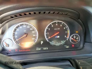 2015 BMW M5 z VIN WBSFV9C54FD594450, wystawiony jako Copart lot #52173915 z przebiegiem 67 267 mil mil oraz Szkoda całkowita • Salvage title. Historia ofert i sprzedaży dostępna na DreamBid. Obrazek 9.