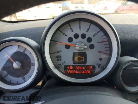 2009 MINI Convertible with VIN WMWMR33559TU96728, listed as a Copart auction lot 77949004 with 86,084 mi miles and Clean title. Bid and sale history available at DreamBid. Image 9.