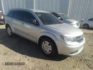2014 Dodge Journey American Value Pkg with VIN 3C4PDCAB2ET186199, listed as a IAAI auction lot 41594478 with 145,936 mi miles. Bid and sale history available at carsss.com. Image 1.