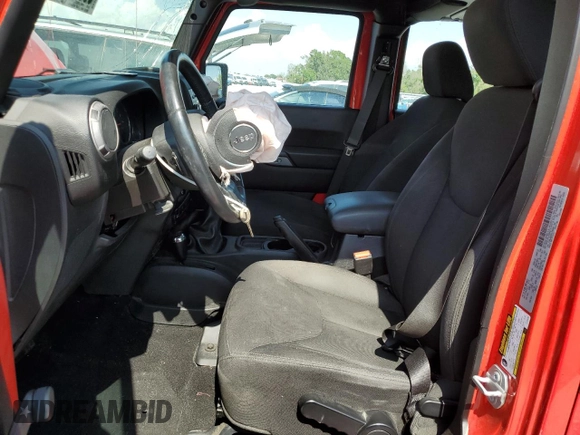 2015 Jeep Wrangler Unlimited Willys Wheeler with VIN 1C4BJWDG3FL726460, listed as a Copart auction lot 55827355 with 96,482 mi miles and Salvage Title. Bid and sale history available at DreamBid. Image 7.