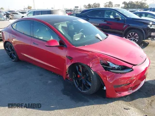 2021 Tesla Model 3 Performance with VIN 5YJ3E1EC9MF926301, listed as a IAAI auction lot 40959721 with 28,094 mi miles and . Bid and sale history available at DreamBid. Image 1.