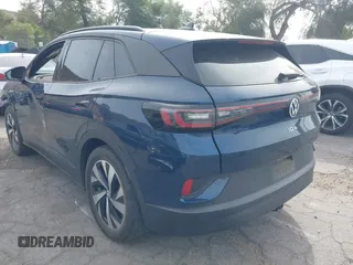 2023 Volkswagen ID.4 Pro z VIN 1V2DNPE8XPC019169, wystawiony jako IAAI lot #41313501 z przebiegiem 32 552 mil mil oraz . Historia ofert i sprzedaży dostępna na DreamBid. Obrazek 3.