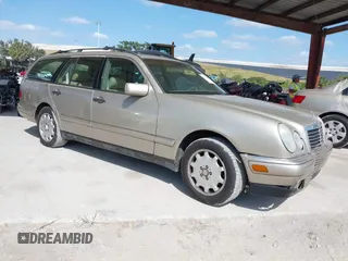 1999 Mercedes-Benz E-Class with VIN WDBJH65F3XA845635, listed as a IAAI auction lot 42102122 with 215,678 mi miles. Bid and sale history available at carsss.com. Image 1.