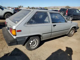 1986 Toyota Tercel z VIN JT2AL31G5G0429131, wystawiony jako Copart lot #79204554 z przebiegiem 124 477 mil mil oraz Szkoda całkowita • Salvage title. Historia ofert i sprzedaży dostępna na DreamBid. Obrazek 3.