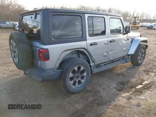 2018 Jeep Wrangler Unlimited Sahara z VIN 1C4HJXEN4JW173435, wystawiony jako IAAI lot #41453040 z przebiegiem 51 530 mil mil oraz . Historia ofert i sprzedaży dostępna na DreamBid. Obrazek 4.