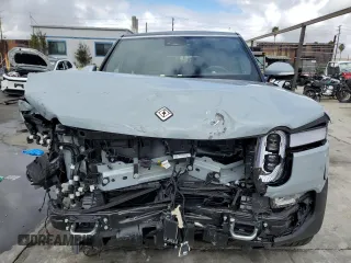 2024 Rivian R1S Adventure with VIN 7PDSGABA7RN038477, listed as a Copart auction lot 48711345 with 0 mi miles and Salvage Title. Bid and sale history available at carsss.com. Image 5.
