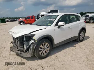 2016 Mazda CX-5 Sport z VIN JM3KE4BY0G0742436, wystawiony jako Copart lot #59693945 z przebiegiem 74 314 mil mil oraz Szkoda całkowita • Salvage title. Historia ofert i sprzedaży dostępna na DreamBid. Obrazek 1.