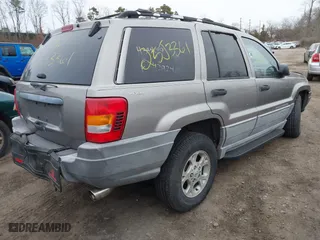 1999 Jeep Grand Cherokee Laredo with VIN 1J4GW58S9XC673310, listed as a IAAI auction lot 41927682 with 999,999 mi miles. Bid and sale history available at carsss.com. Image 4.