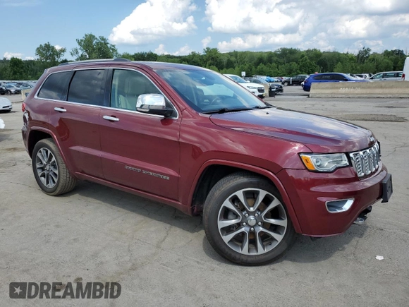 2017 Jeep Grand Cherokee Overland with VIN 1C4RJFCG5HC874130, listed as a Copart auction lot 65324695 with 101,588 mi miles and Salvage title. Bid and sale history available at DreamBid. Image 4.