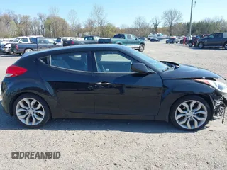 2013 Hyundai Veloster w/Gray Int with VIN KMHTC6AD4DU131242, listed as a IAAI auction lot 42074517 with 76,713 mi miles and . Bid and sale history available at DreamBid. Image 13.
