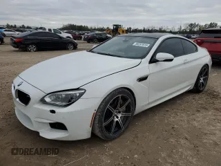 2014 BMW M6 z VIN WBSLX9C51ED160143, wystawiony jako Copart lot #88287015 z przebiegiem 91 717 mil mil oraz Szkody całkowita. Historia ofert i sprzedaży dostępna na DreamBid. Obrazek 1.