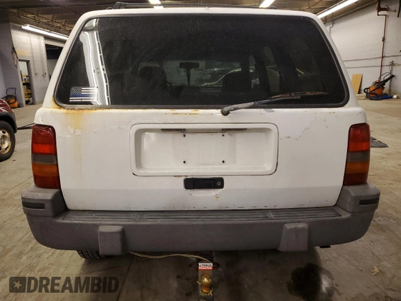 1993 Jeep Grand Cherokee Laredo with VIN 1J4GZ58SXPC554642, listed as a Copart auction lot 83268254 with 266,063 mi miles and Salvage Title. Bid and sale history available at carsss.com. Image 6.