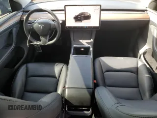 2024 Tesla Model Y with VIN 7SAYGDED0RF131495, listed as a Copart auction lot 56849765 with 10,120 mi miles and Salvage title. Bid and sale history available at DreamBid. Image 8.