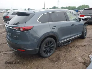 2022 Mazda CX-9 Grand Touring with VIN JM3TCBDY0N0615968, listed as a IAAI auction lot 42312159 with 22,912 mi miles and . Bid and sale history available at DreamBid. Image 4.