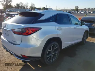 2022 Lexus RX with VIN 2T2HGMDA8NC074588, listed as a IAAI auction lot 41828234 with 106,845 mi miles. Bid and sale history available at carsss.com. Image 4.