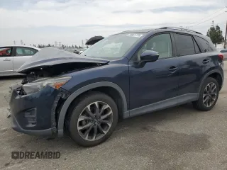 2016 Mazda CX-5 Grand Touring z VIN JM3KE2DY0G0864778, wystawiony jako Copart lot #58661775 z przebiegiem 90 070 mil mil oraz Szkoda całkowita • Salvage title. Historia ofert i sprzedaży dostępna na DreamBid. Obrazek 1.