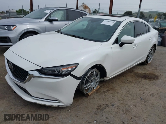 2018 Mazda 6 Grand Touring Reserve with VIN JM1GL1WYXJ1300116, listed as a IAAI auction lot 42088015 with 57,760 mi miles and . Bid and sale history available at DreamBid. Image 17.