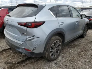 2023 Mazda CX-5 S Premium with VIN JM3KFBDM8P0203834, listed as a Copart auction lot 52496815 with 54,306 mi miles and Non Repairable. Bid and sale history available at DreamBid. Image 3.