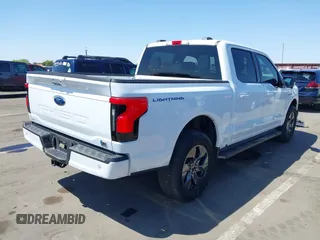 2023 Ford F-150 Lightning Pro with VIN 1FTVW1EL4PWG42578, listed as a IAAI auction lot 41992446 with 26,729 mi miles and . Bid and sale history available at DreamBid. Image 4.