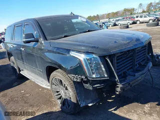 2015 Cadillac Escalade Platinum with VIN 1GYS4PKJ4FR557066, listed as a IAAI auction lot 41451905 with 116,071 mi miles. Bid and sale history available at carsss.com. Image 1.