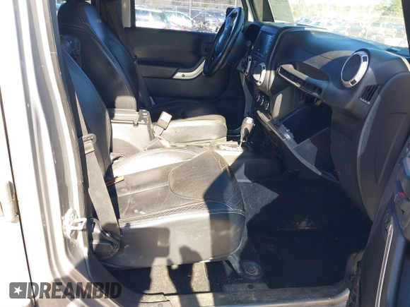 2015 Jeep Wrangler Unlimited Rubicon Hard Rock with VIN 1C4HJWFG2FL587607, listed as a IAAI auction lot 41419237 with 109,719 mi miles and . Bid and sale history available at DreamBid. Image 5.