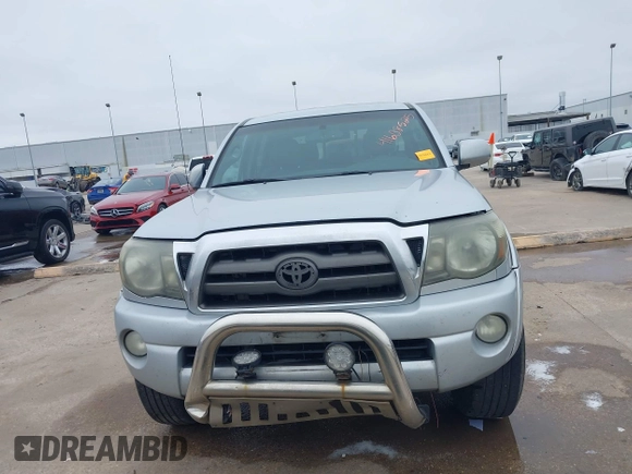 2009 Toyota Tacoma PreRunner with VIN 3TMJU62NX9M081748, listed as a IAAI auction lot 41608525 with 210,999 mi miles. Bid and sale history available at carsss.com. Image 12.