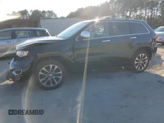 2017 Jeep Grand Cherokee Overland with VIN 1C4RJFCT5HC828780, listed as a Copart auction lot 46874965 with 90,269 mi miles and Salvage Title. Bid and sale history available at carsss.com. Image 1.