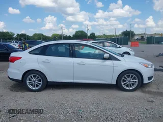 2015 Ford Focus SE with VIN 1FADP3F2XFL335884, listed as a IAAI auction lot 42582740 with 102,036 mi miles and . Bid and sale history available at DreamBid. Image 13.