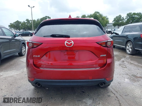 2018 Mazda CX-5 Grand Touring with VIN JM3KFADM5J0437365, listed as a IAAI auction lot 42657919 with 96,760 mi miles and . Bid and sale history available at DreamBid. Image 16.