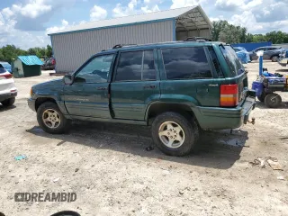 1998 Jeep Grand Cherokee Laredo with VIN 1J4GZ48S5WC289251, listed as a Copart auction lot 63594685 with 156,358 mi miles and Salvage title. Bid and sale history available at DreamBid. Image 2.