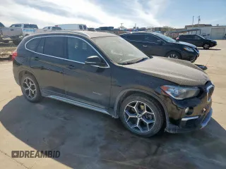 2018 BMW X1 sDrive28i with VIN WBXHU7C31J5H39068, listed as a Copart auction lot 49018985 with 100,611 mi miles and Salvage Title. Bid and sale history available at carsss.com. Image 4.