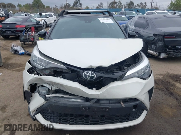 2020 Toyota C-HR LE with VIN JTNKHMBX9L1092934, listed as a IAAI auction lot 42021972 with 56,777 mi miles and . Bid and sale history available at DreamBid. Image 12.