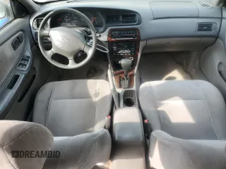 1999 Nissan Altima XE z VIN 1N4DL01D1XC202466, wystawiony jako Copart lot #54548015 z przebiegiem 131 409 mil mil oraz Szkoda całkowita • Salvage title. Historia ofert i sprzedaży dostępna na DreamBid. Obrazek 8.